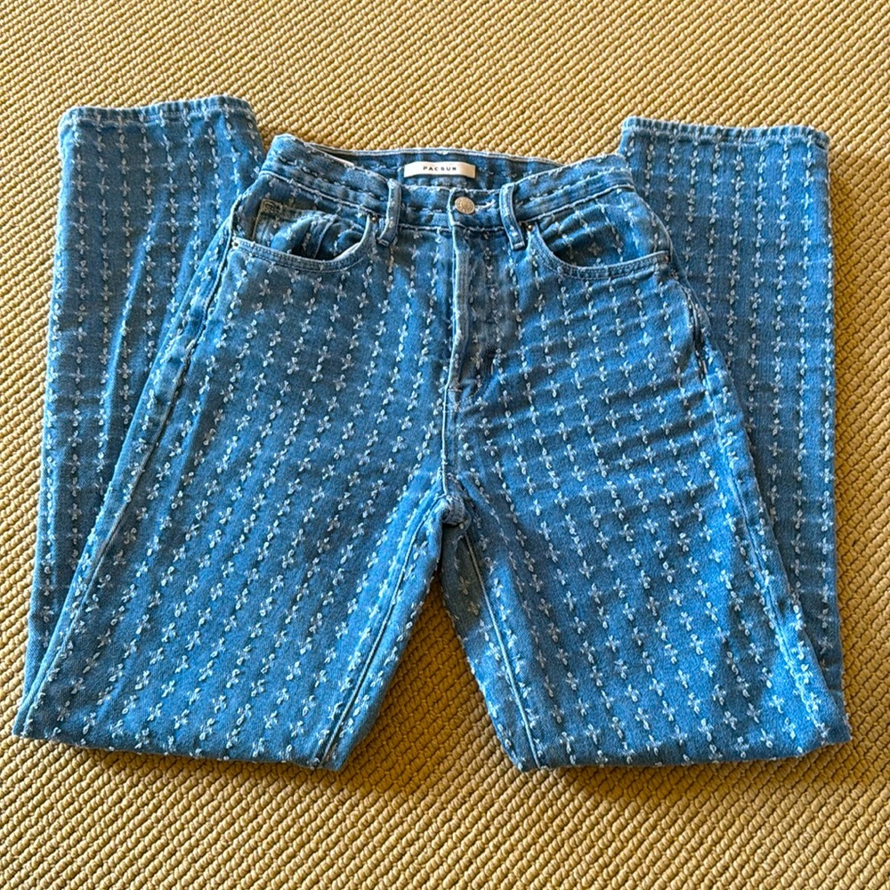 Women’s blue jeans from PacSun. Size 23 dad jean with five buttons.